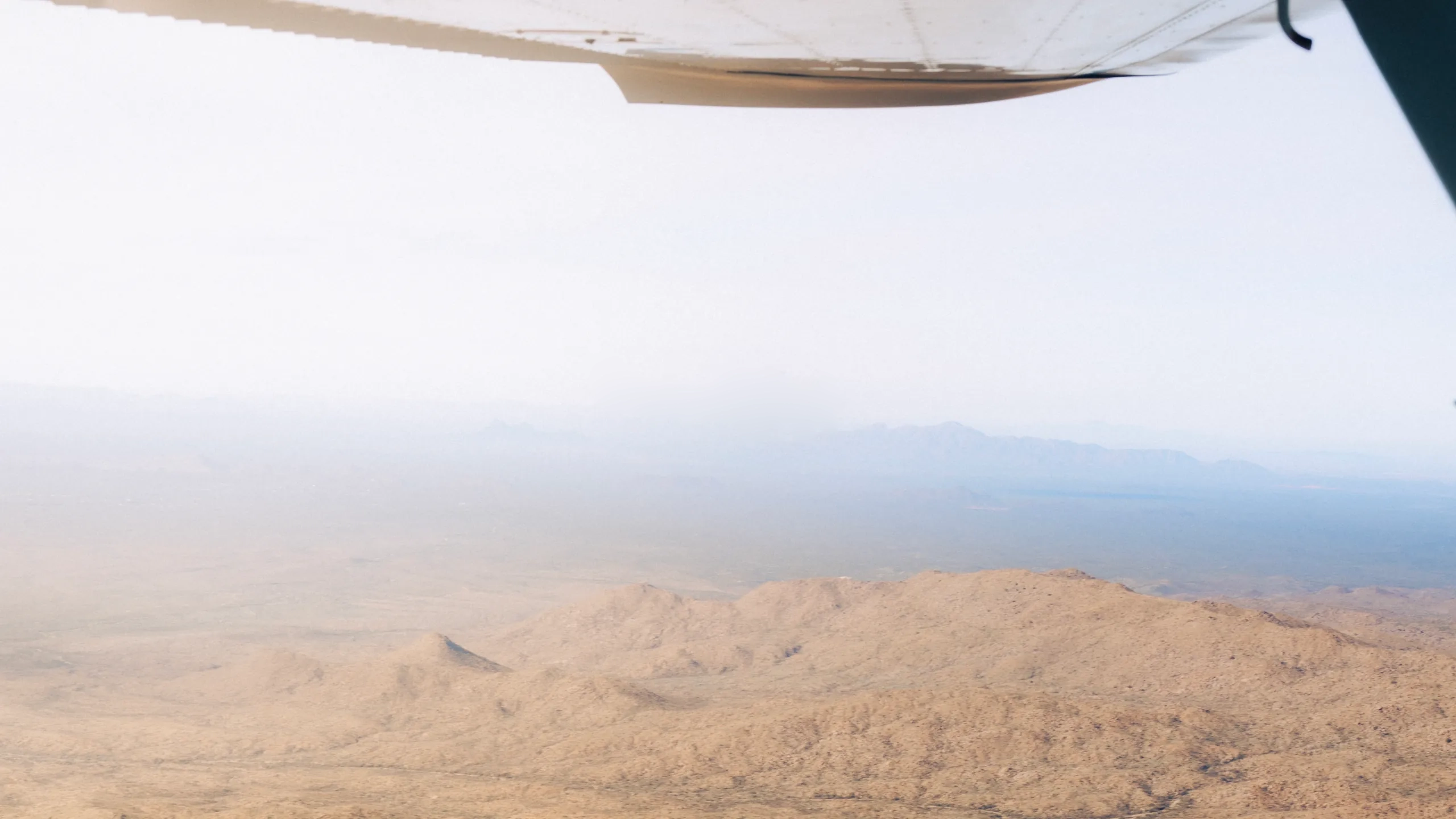 Flying shot over Arizona with hills in the background