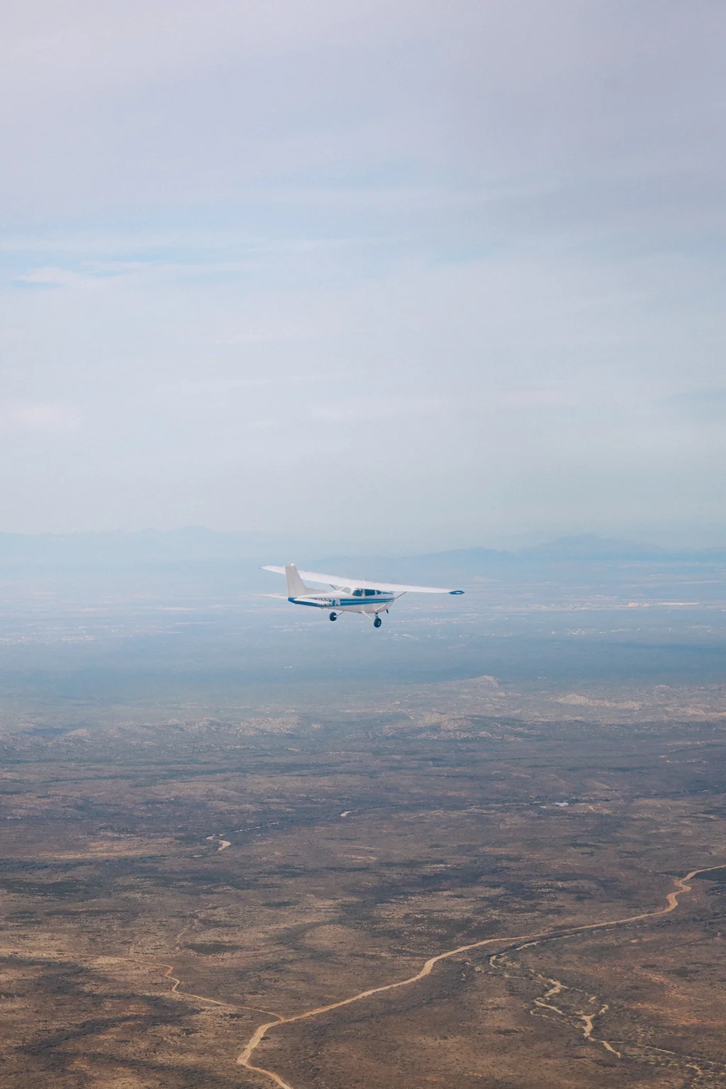 SimpliFly Flight School Cessna flying over desert trails in southern Arizona