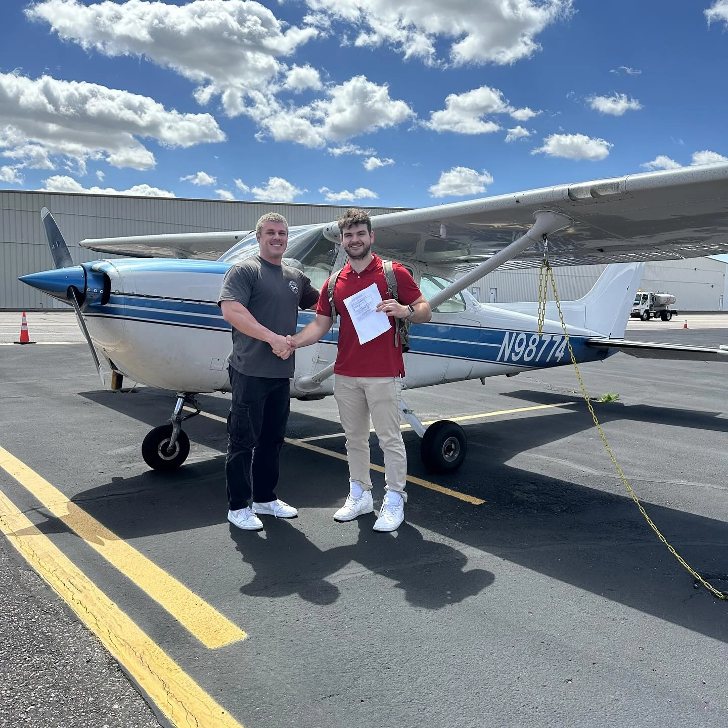 SimpliFly flight instructor congratulating a student after a successful checkride