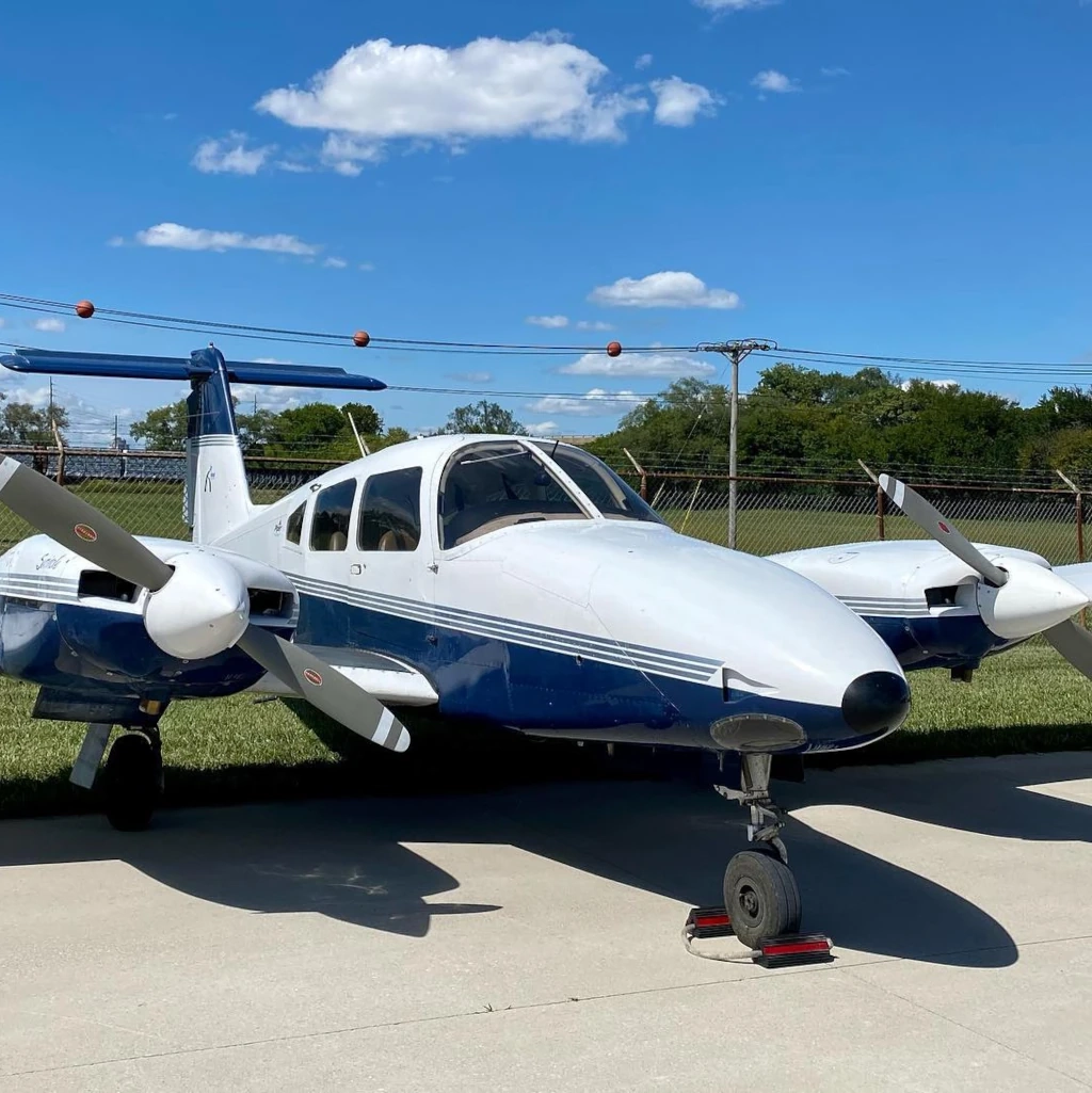 Multi-engine airplane parked seen from the front