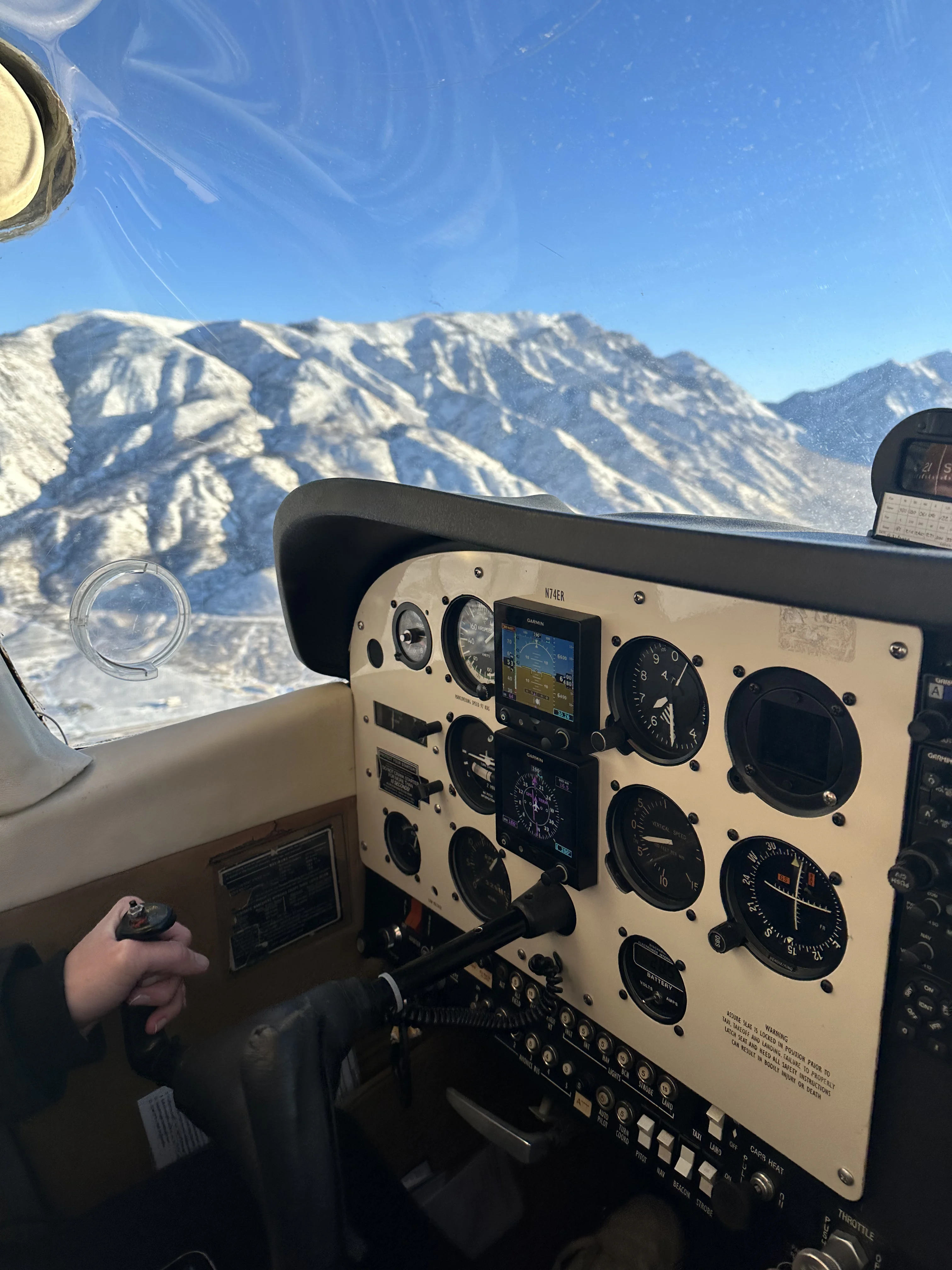 Instrument panel of an aircraft flying over the mountains of Arizona